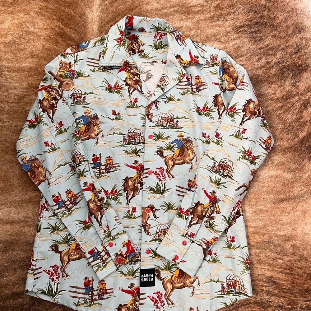 Aloha western shirt with cowboys riding horses in light blue!